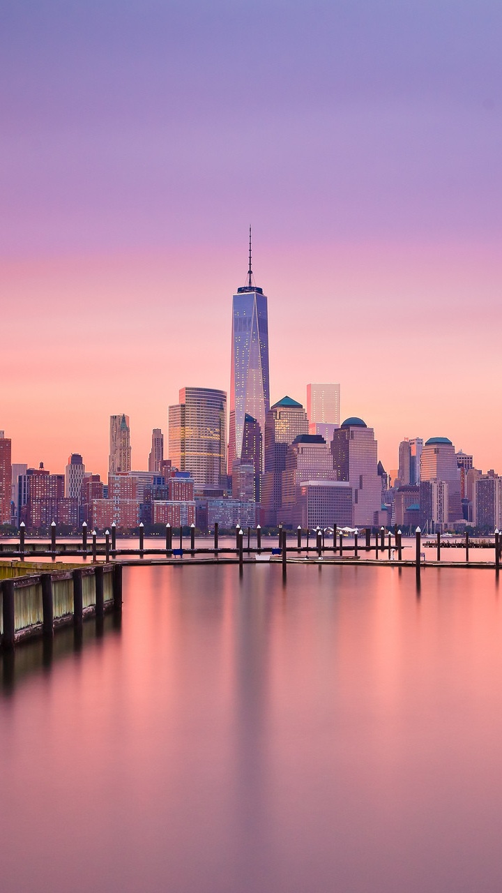 City Skyline Across Body of Water During Daytime. Wallpaper in 720x1280 Resolution