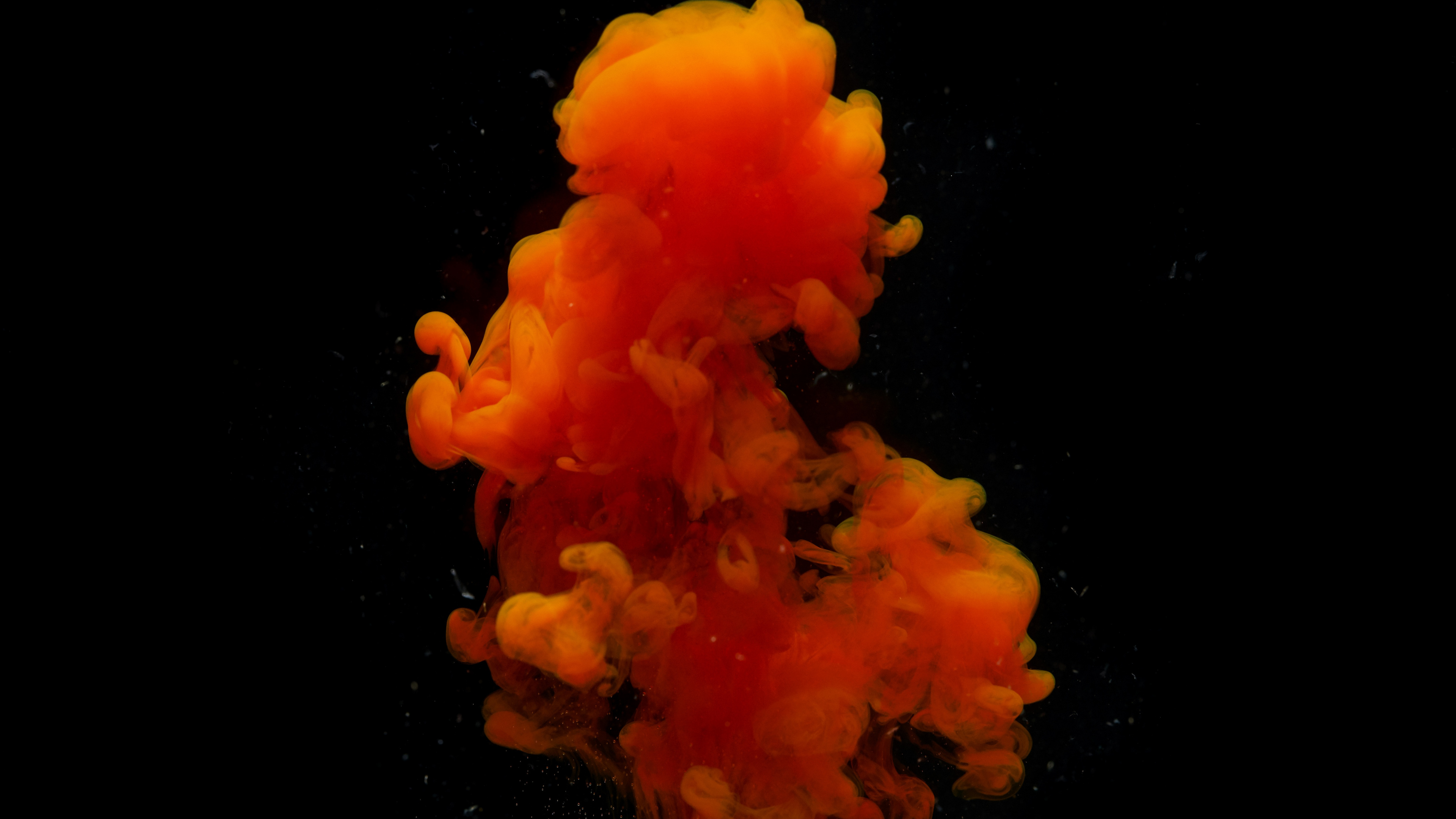 Orange Smoke in Black Background. Wallpaper in 3840x2160 Resolution