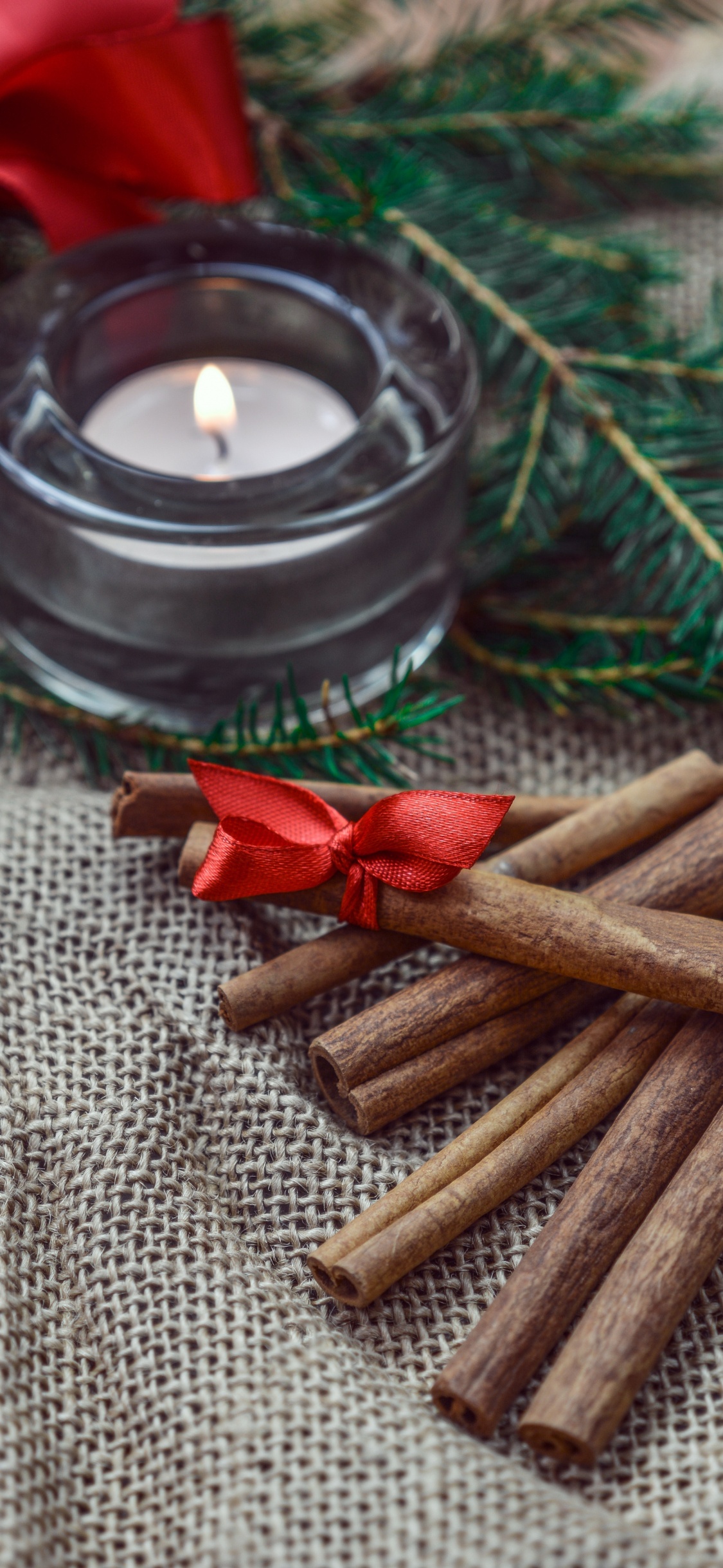 Brown Sticks on Brown Textile. Wallpaper in 1125x2436 Resolution