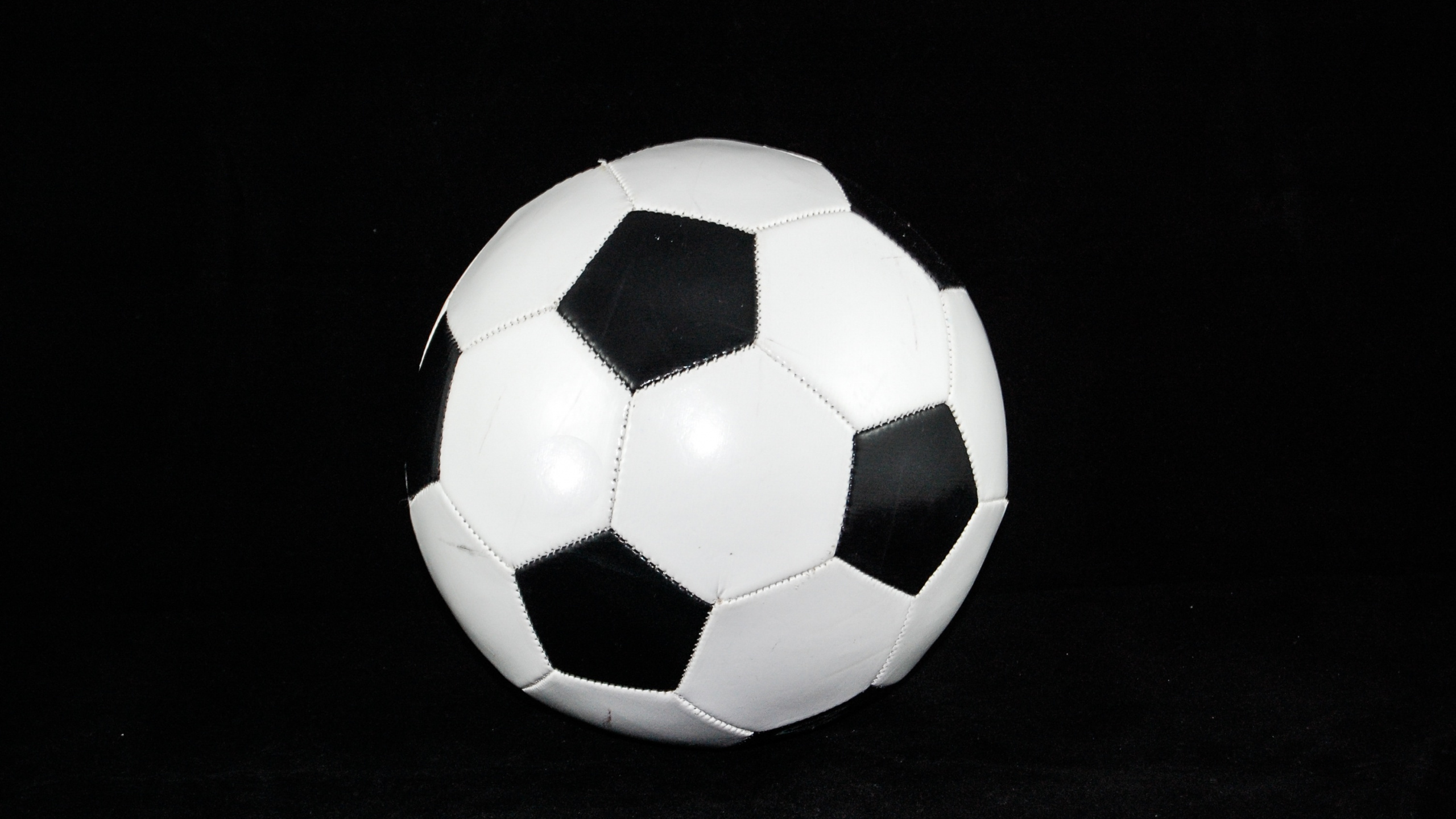 White and Black Soccer Ball. Wallpaper in 2560x1440 Resolution
