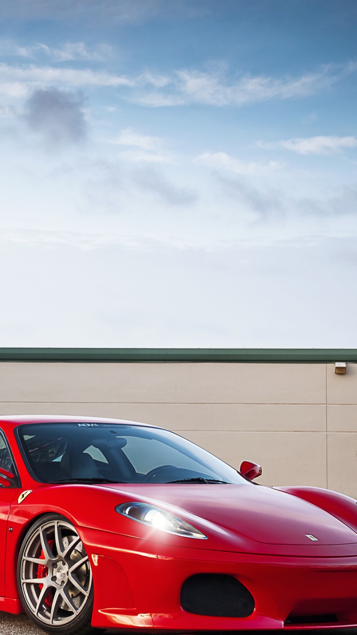 Red Sedan Parked on Gray Concrete Pavement During Daytime. Wallpaper in 720x1280 Resolution