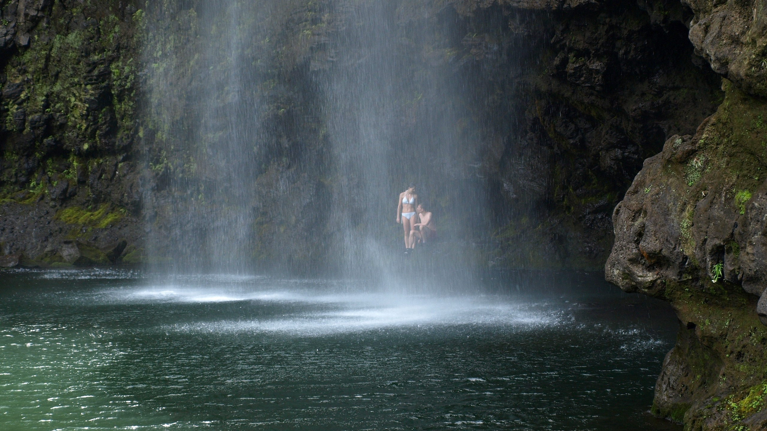 Person in Water Falls During Daytime. Wallpaper in 2560x1440 Resolution