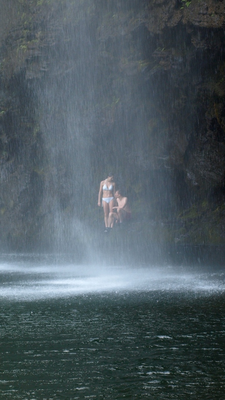 Person in Water Falls During Daytime. Wallpaper in 720x1280 Resolution