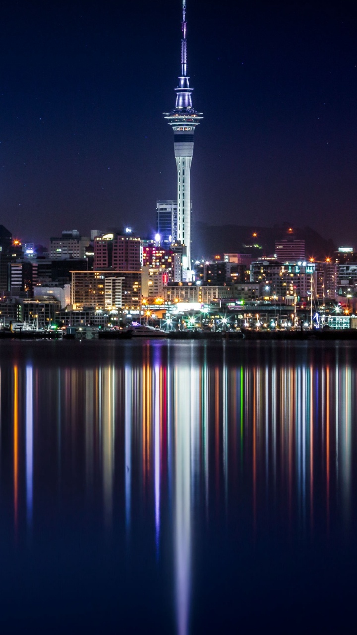 City Skyline During Night Time. Wallpaper in 720x1280 Resolution