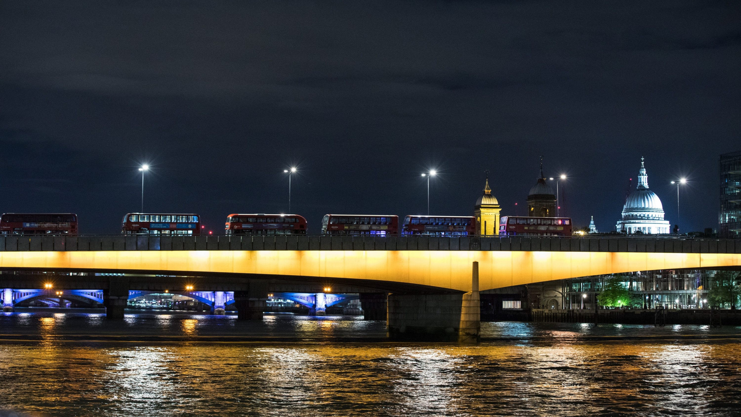 Lighted Bridge Over Water During Night Time. Wallpaper in 2560x1440 Resolution