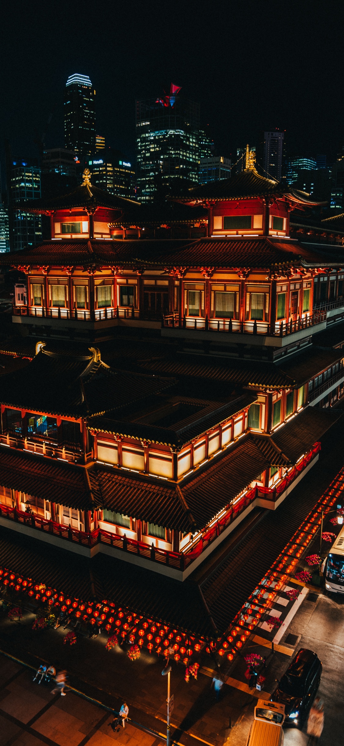 Red and Brown Temple During Night Time. Wallpaper in 1125x2436 Resolution
