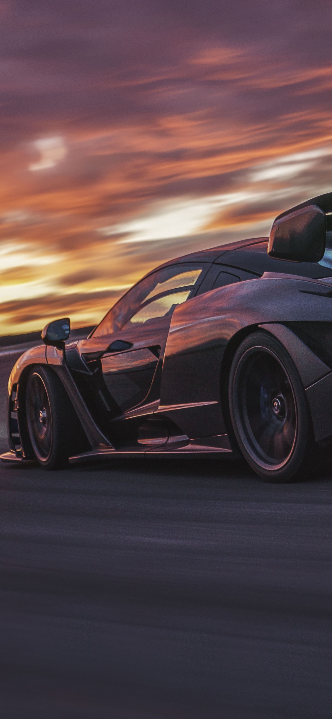 Porsche 911 Noire Sur Route Pendant le Coucher du Soleil. Wallpaper in 1125x2436 Resolution