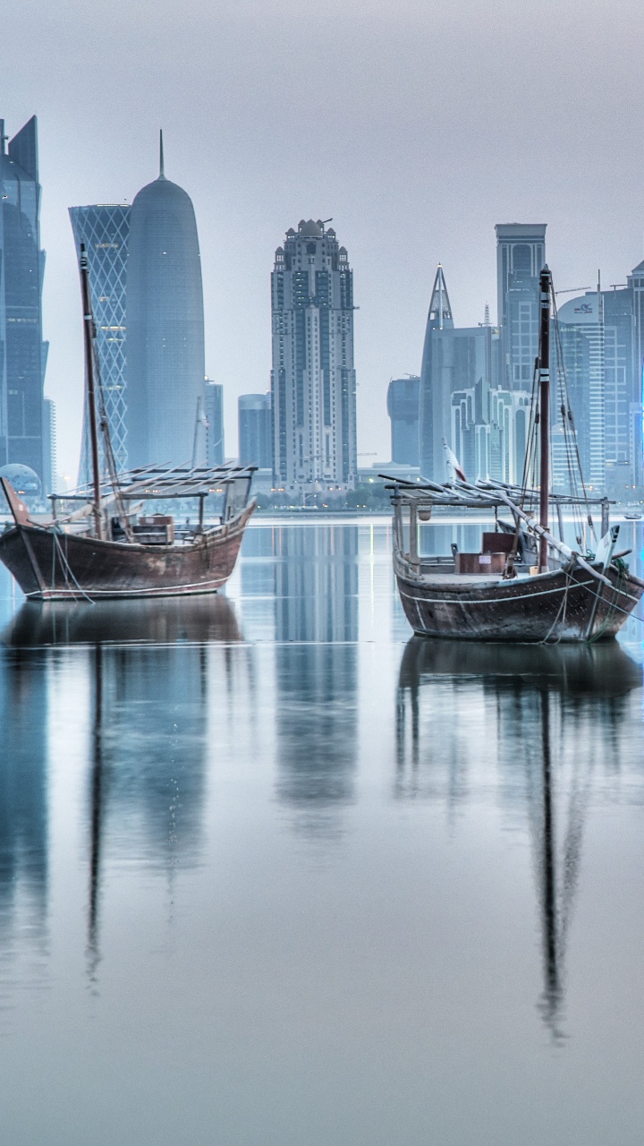 White and Blue Boat on Water Near City Buildings During Daytime. Wallpaper in 720x1280 Resolution