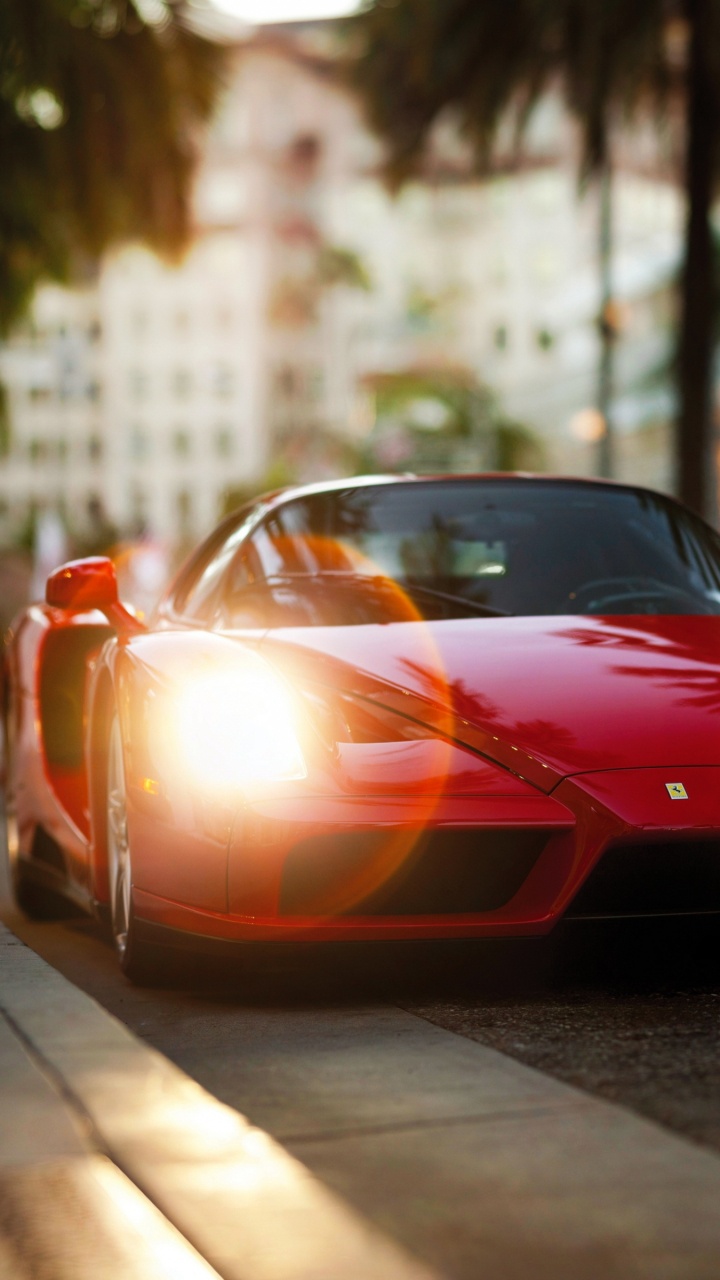 Red Ferrari Sports Car on Road During Daytime. Wallpaper in 720x1280 Resolution