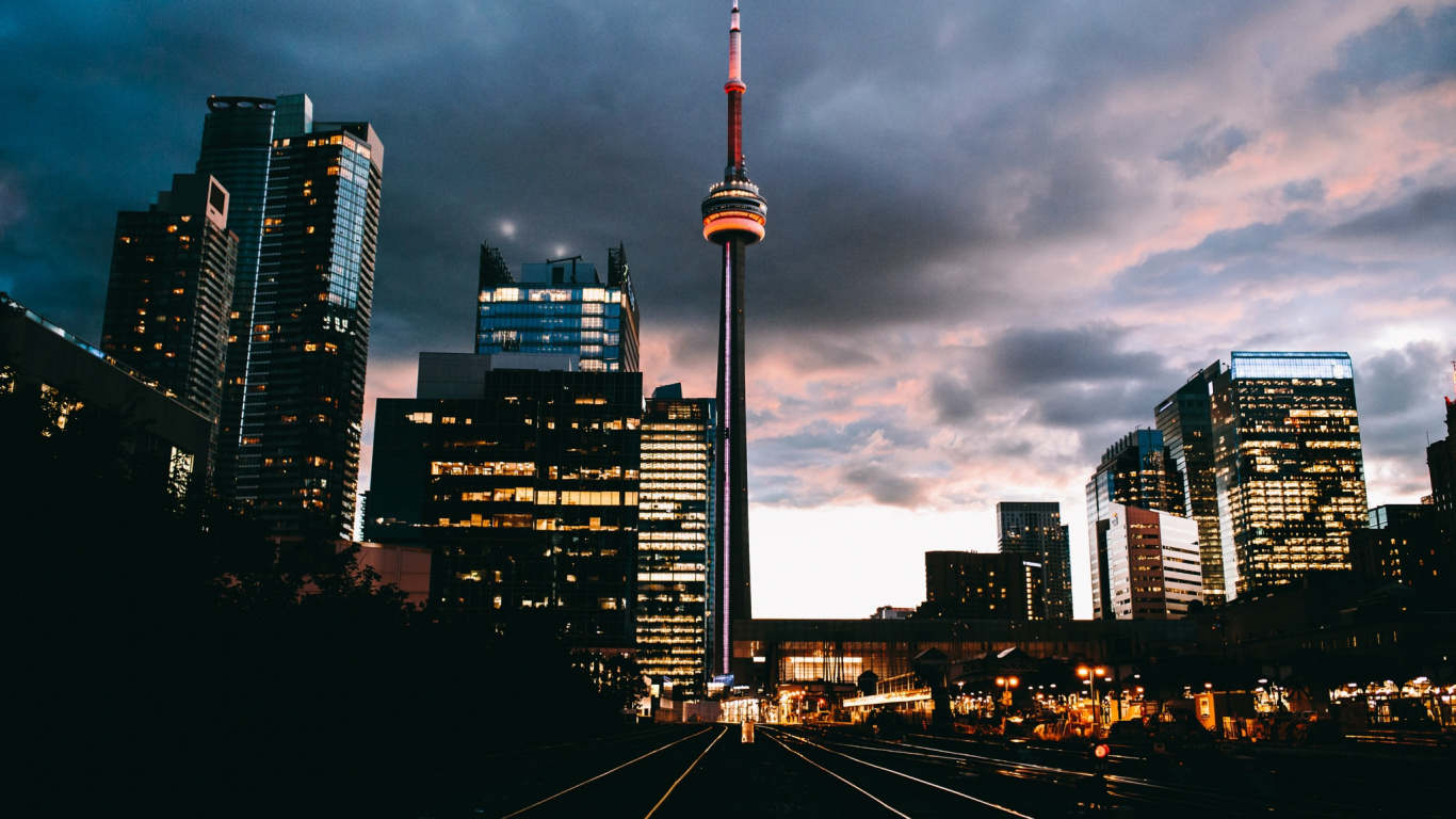 City Skyline Under Gray Cloudy Sky During Daytime. Wallpaper in 1366x768 Resolution