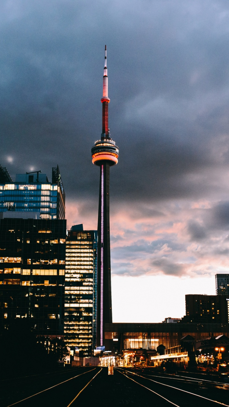 City Skyline Under Gray Cloudy Sky During Daytime. Wallpaper in 750x1334 Resolution