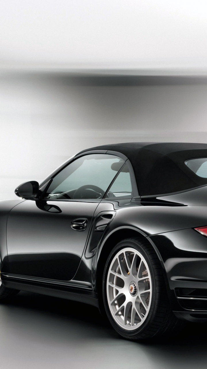 Schwarzer Porsche 911 in Einem Zimmer Geparkt. Wallpaper in 720x1280 Resolution