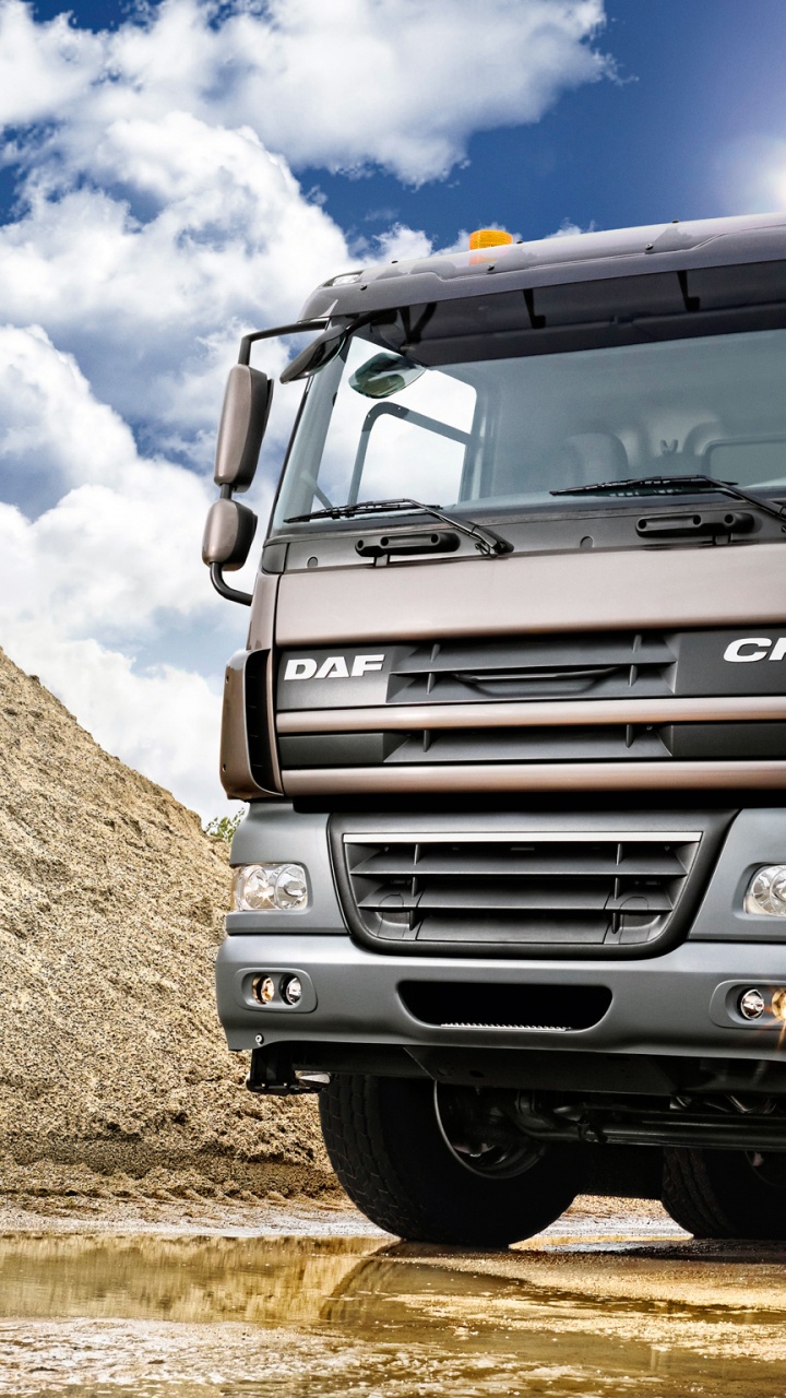 Brown and Gray Truck on Brown Field Under Blue and White Sunny Cloudy Sky During Daytime. Wallpaper in 720x1280 Resolution