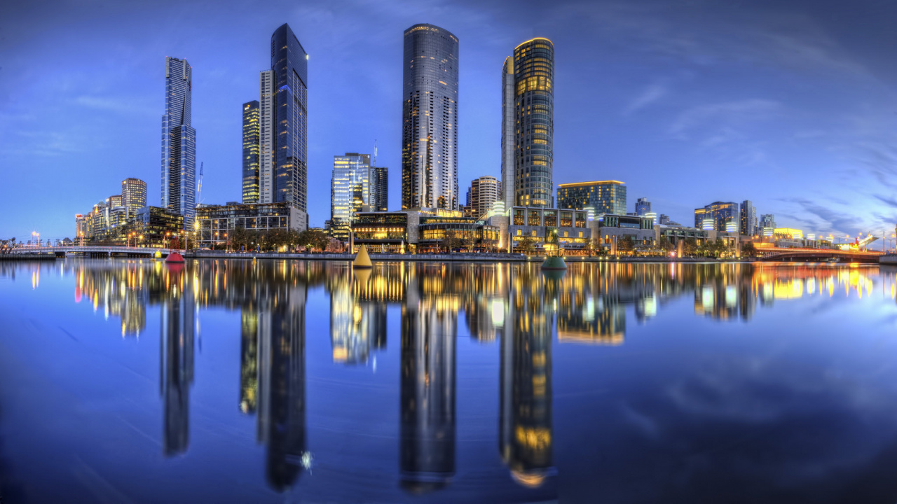 City Skyline Across Body of Water During Night Time. Wallpaper in 1280x720 Resolution