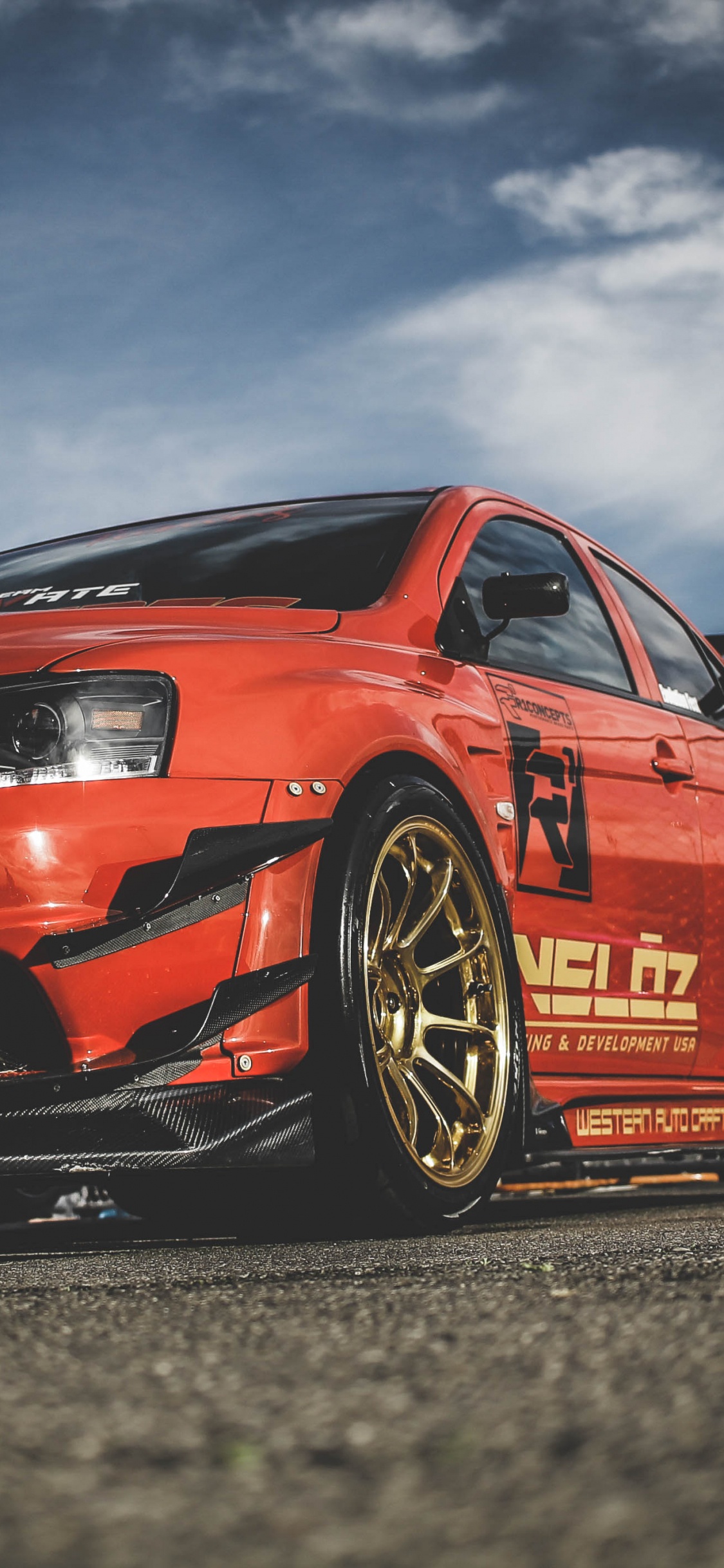 Red Audi r 8 on Road During Daytime. Wallpaper in 1125x2436 Resolution