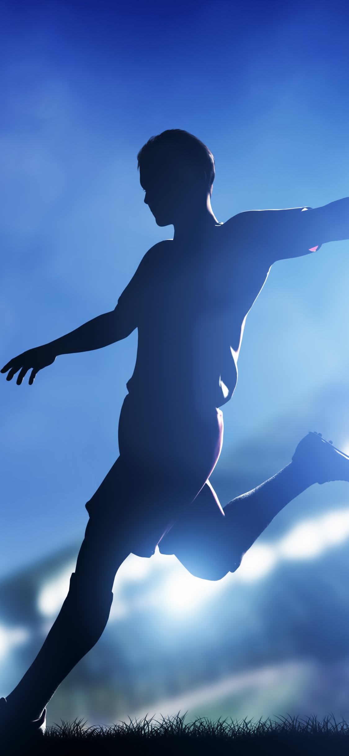 Man in Black Shorts Playing Soccer Ball. Wallpaper in 1125x2436 Resolution