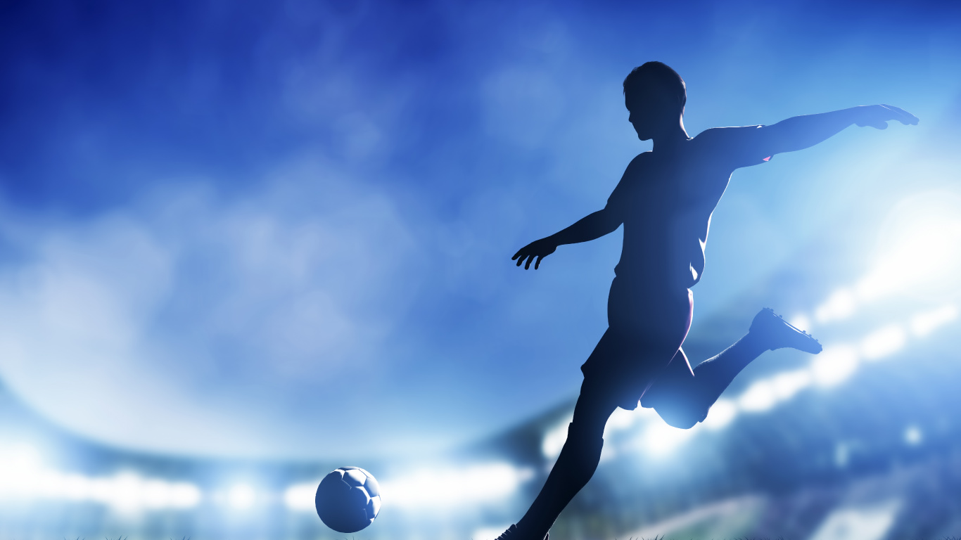 Man in Black Shorts Playing Soccer Ball. Wallpaper in 1366x768 Resolution