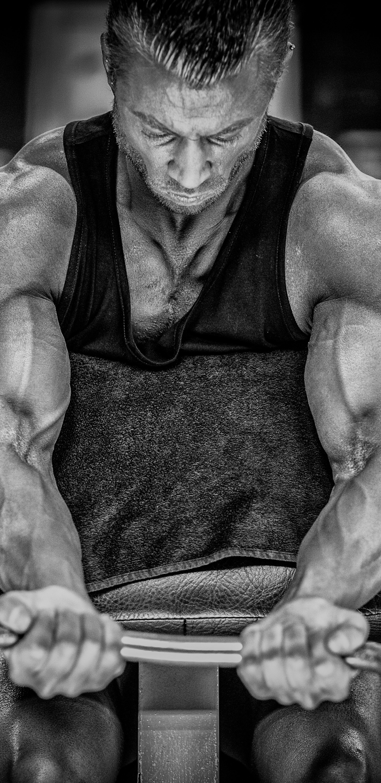 Topless Man in Black Shorts Sitting on Gray Metal Bar. Wallpaper in 1440x2960 Resolution