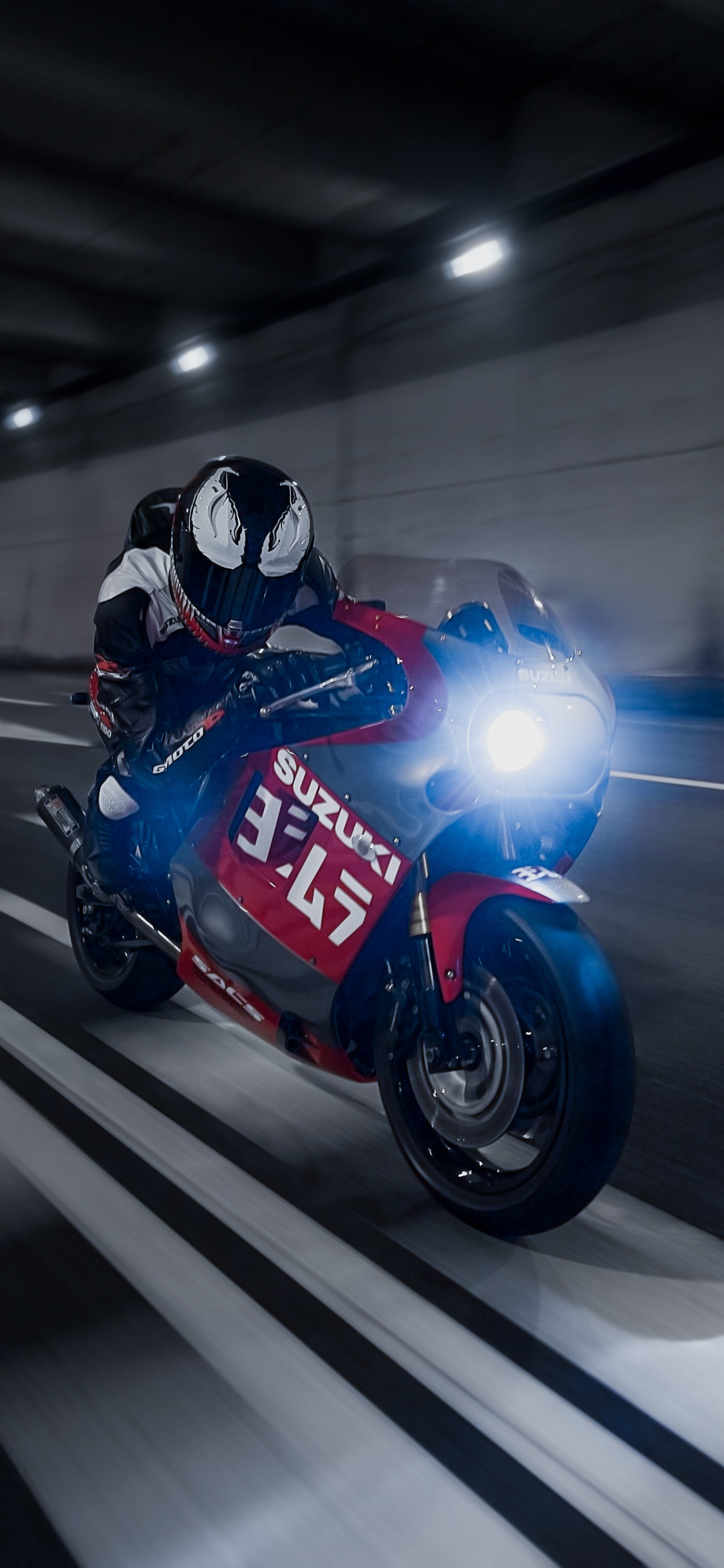 Man in Blue and Black Motorcycle Helmet Riding on Red Sports Bike. Wallpaper in 1125x2436 Resolution