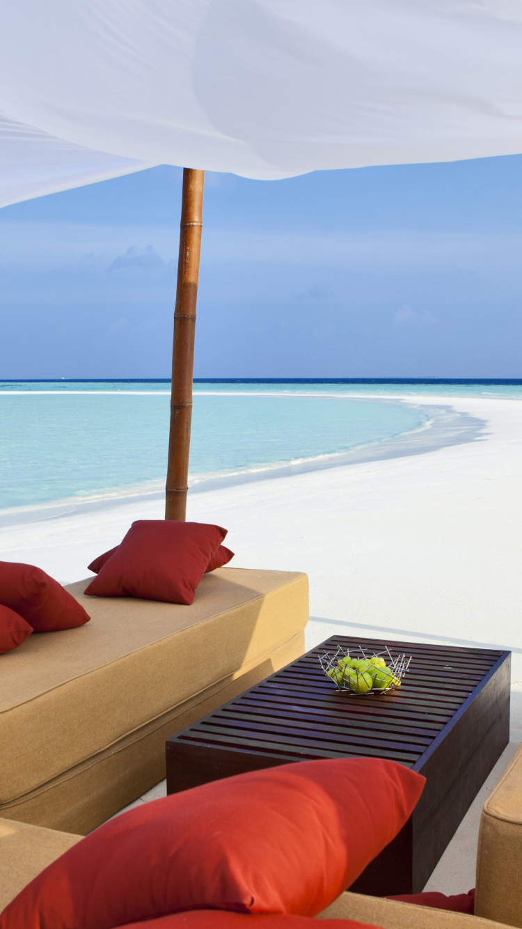 Red Throw Pillow on Brown Couch. Wallpaper in 750x1334 Resolution