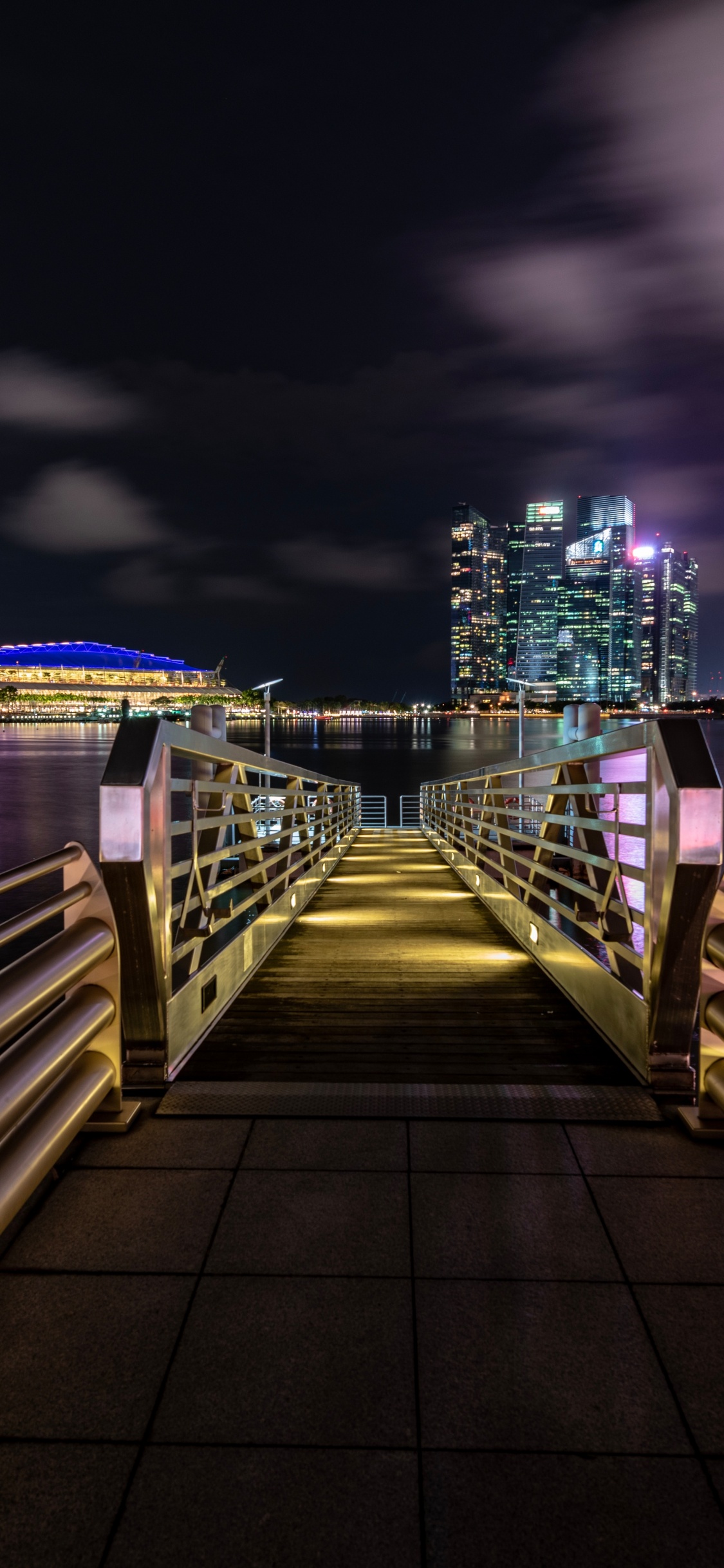 Brown Wooden Dock on River During Night Time. Wallpaper in 1125x2436 Resolution