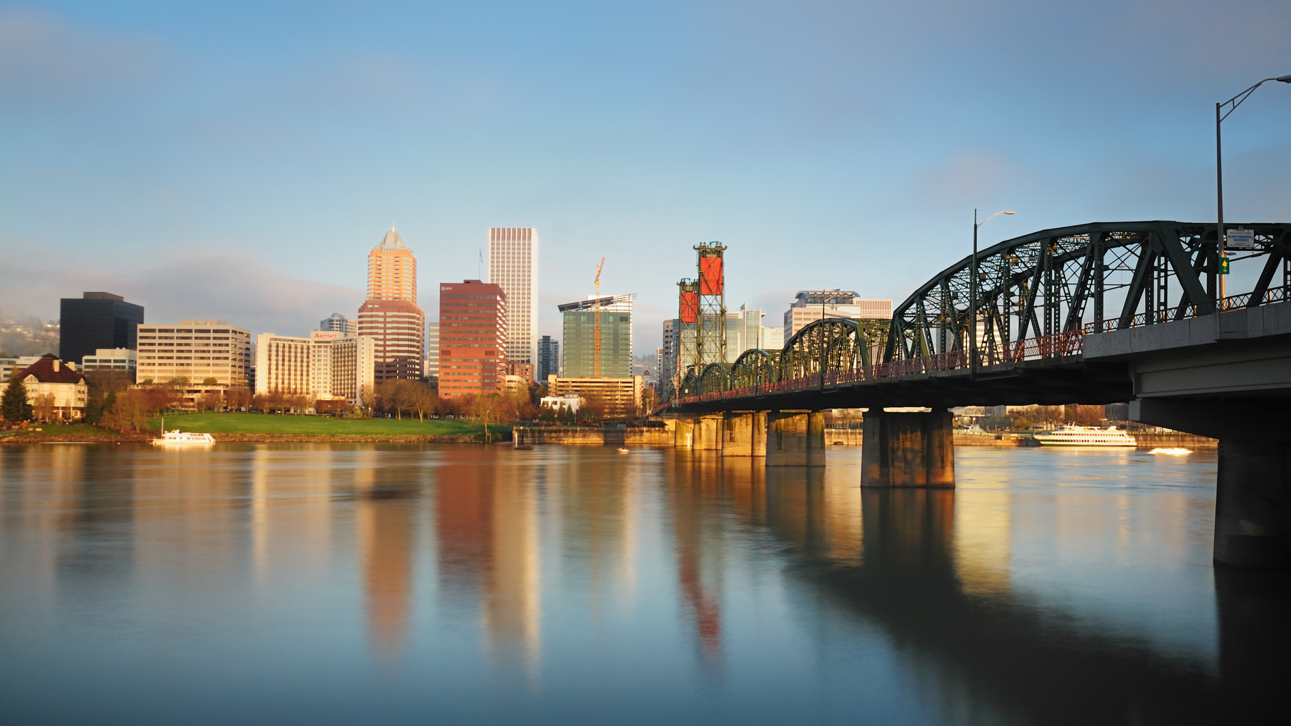 City Skyline Across Body of Water During Daytime. Wallpaper in 2560x1440 Resolution