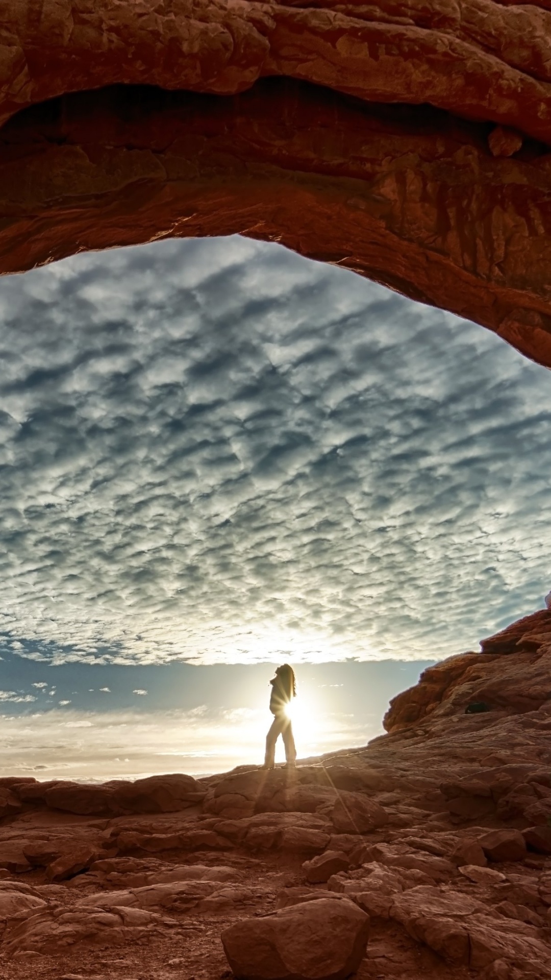 Person Standing on Brown Rock Formation During Daytime. Wallpaper in 1080x1920 Resolution