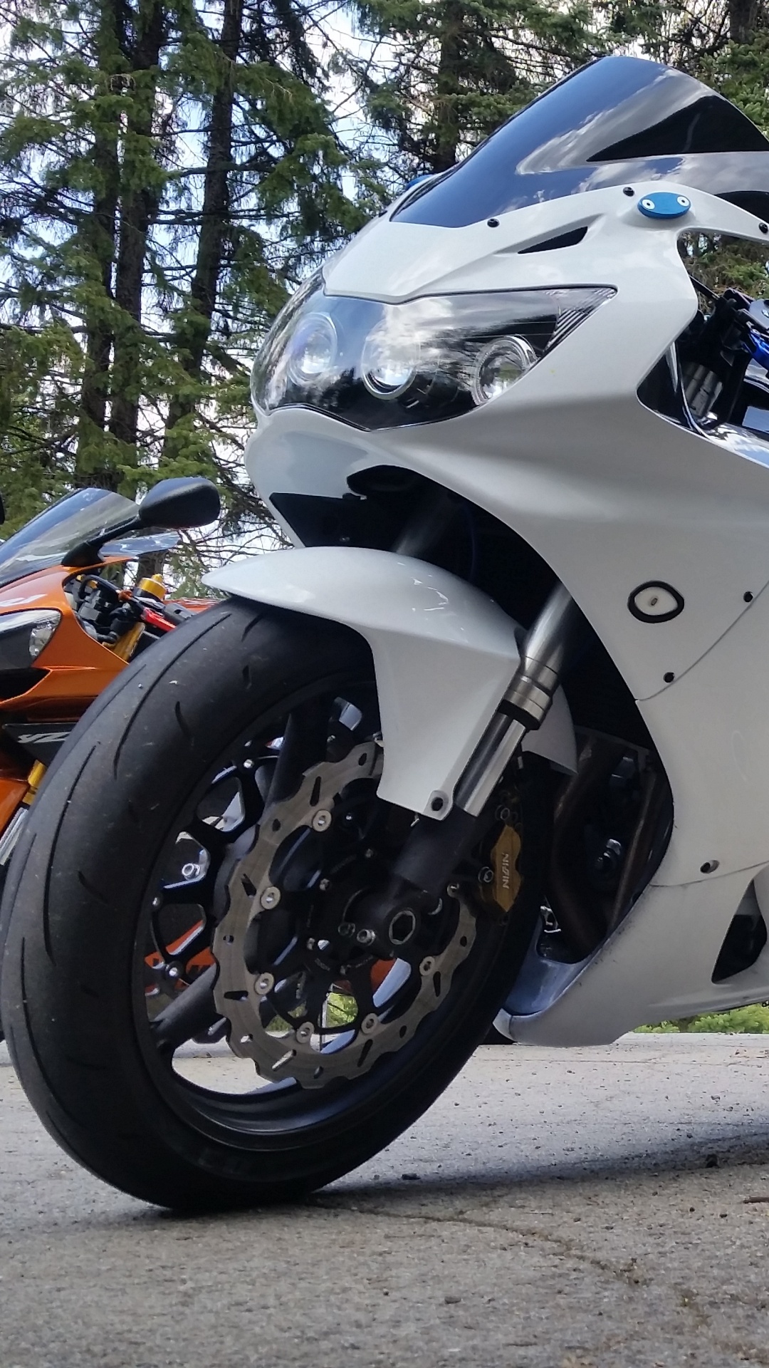 White and Black Sports Bike Parked on Dirt Road During Daytime. Wallpaper in 1080x1920 Resolution