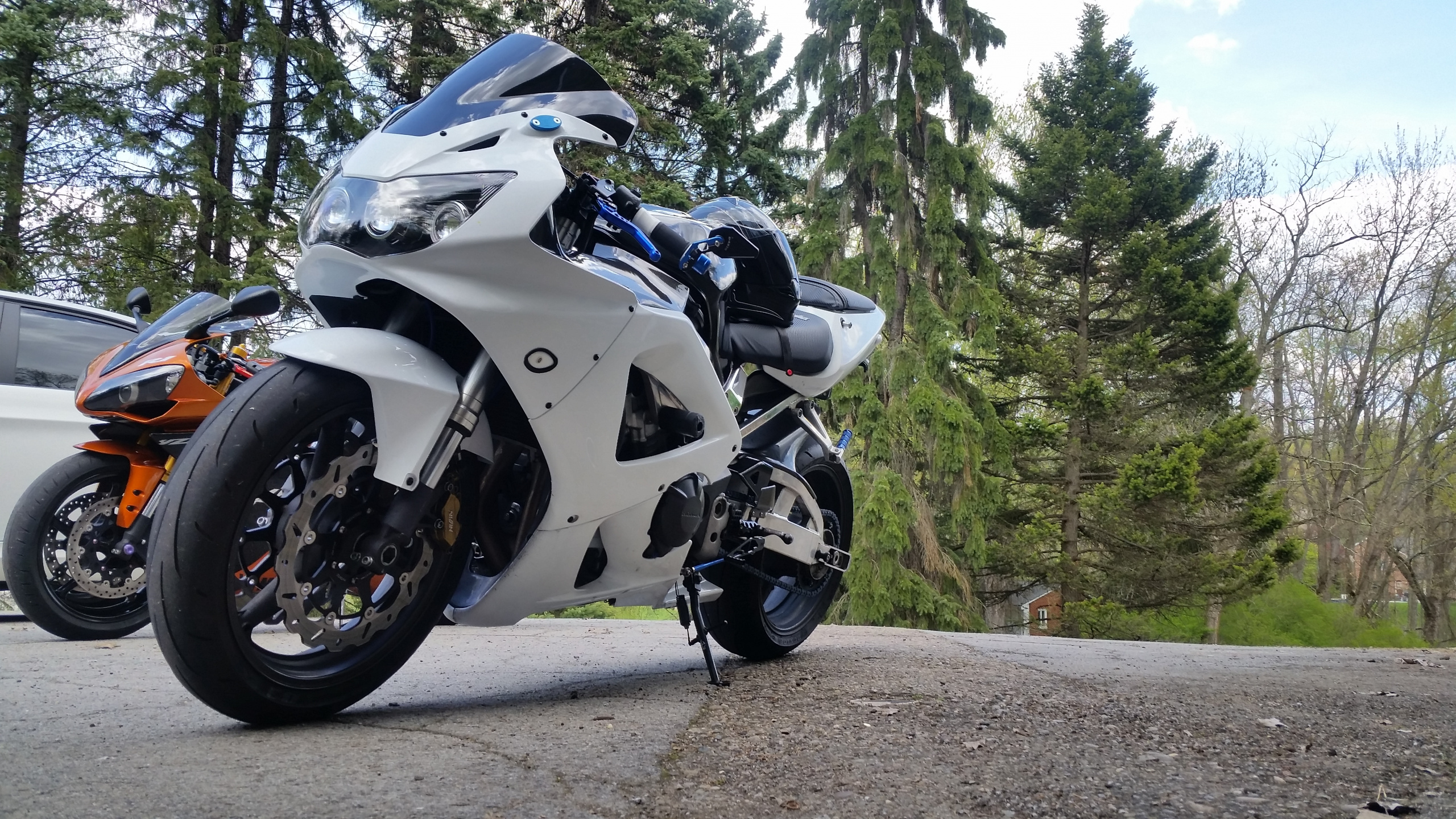 White and Black Sports Bike Parked on Dirt Road During Daytime. Wallpaper in 2560x1440 Resolution