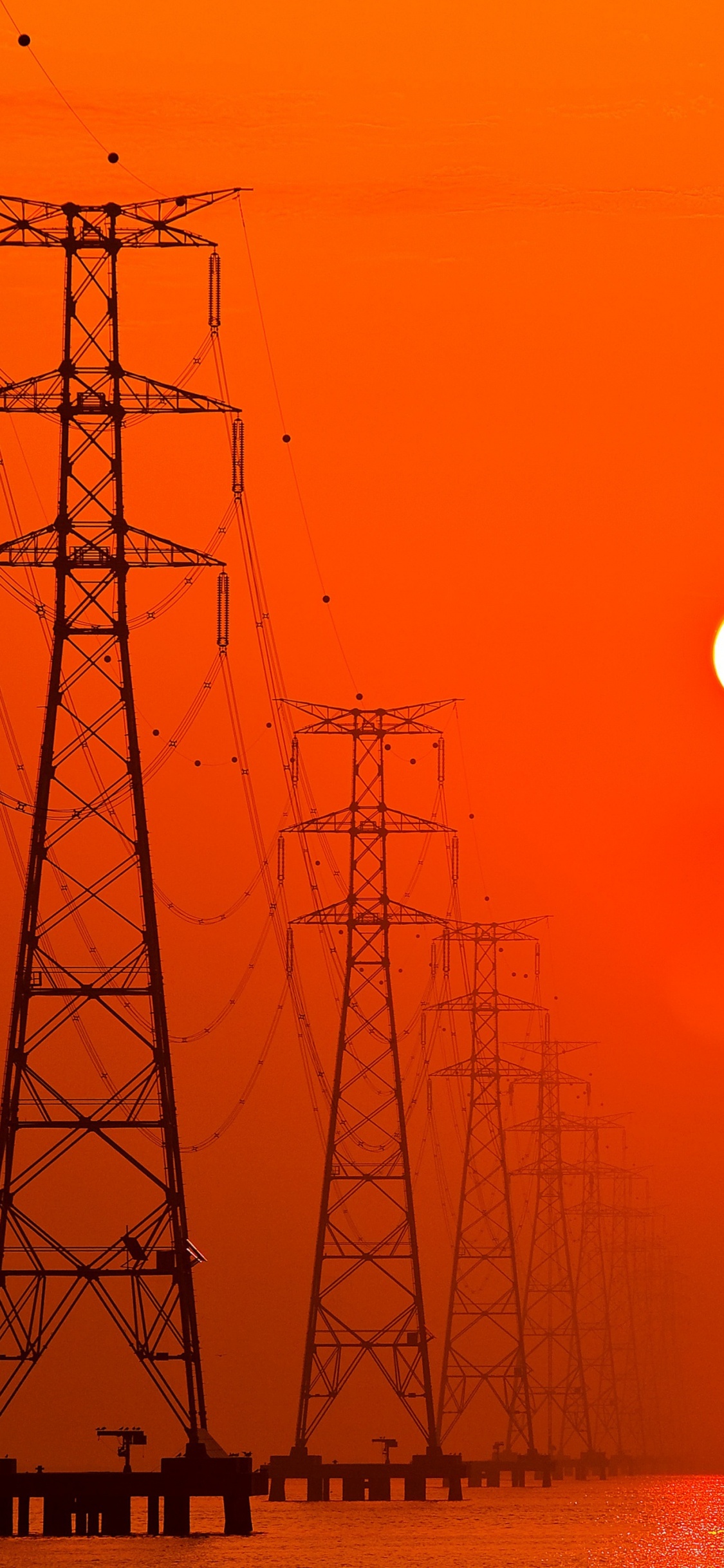 Silhouette of Electric Tower During Sunset. Wallpaper in 1125x2436 Resolution