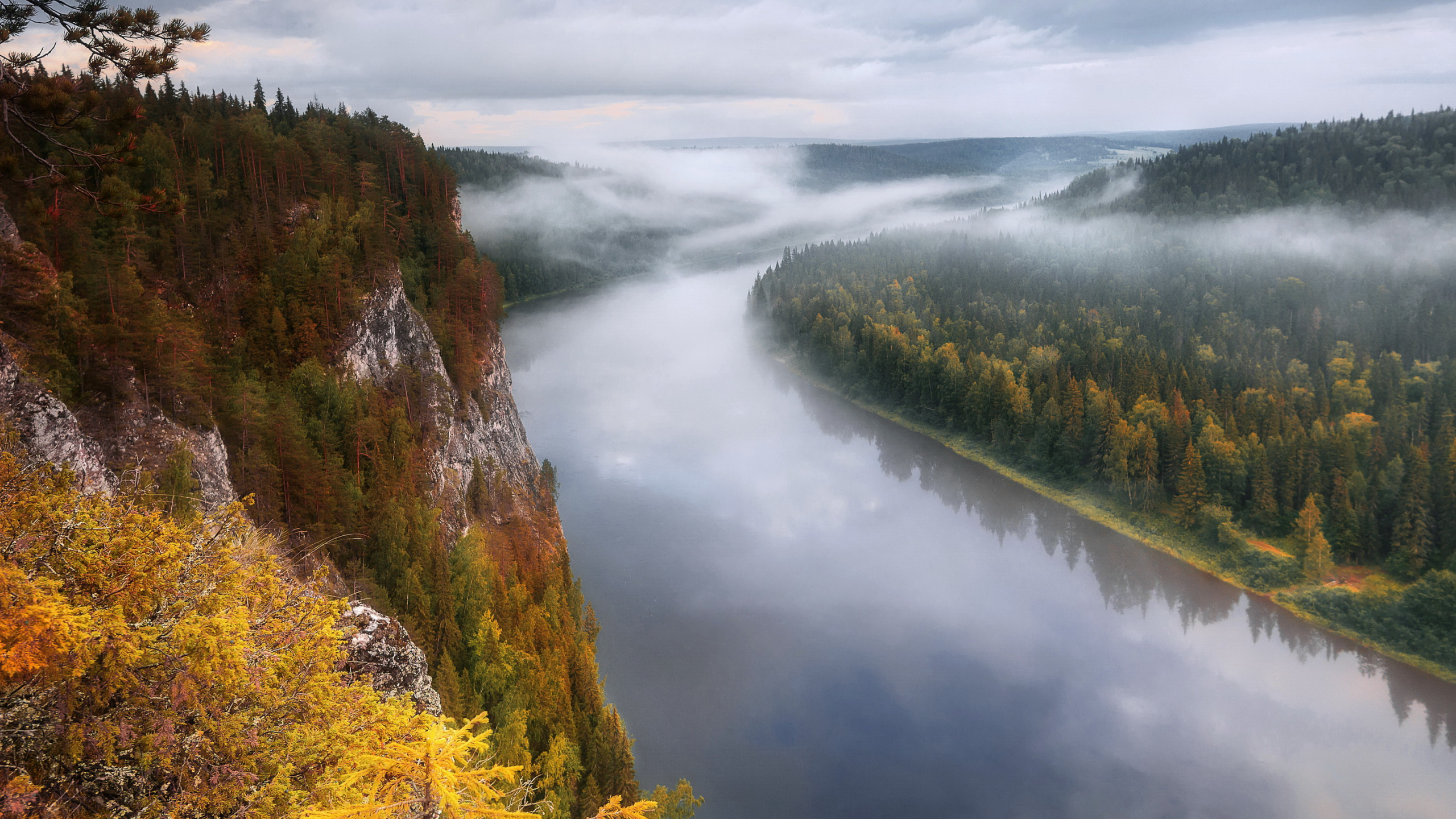 Green and Brown Mountain Beside River Under Cloudy Sky During Daytime. Wallpaper in 2560x1440 Resolution