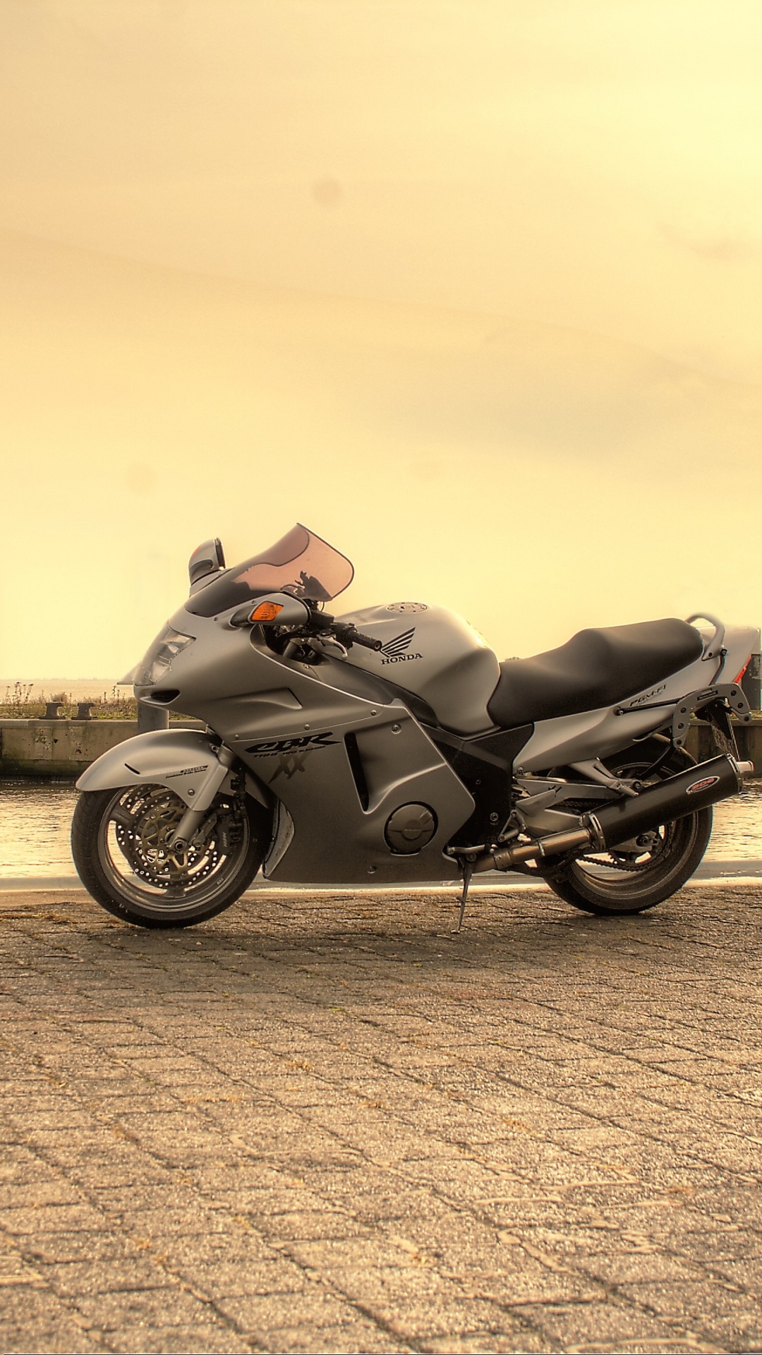 Black Motorcycle Parked on Gray Concrete Pavement During Daytime. Wallpaper in 1080x1920 Resolution