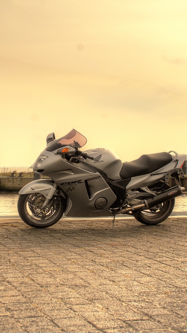 Black Motorcycle Parked on Gray Concrete Pavement During Daytime. Wallpaper in 720x1280 Resolution