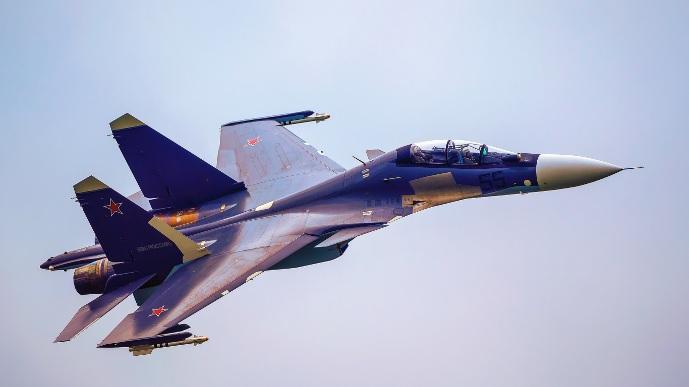 Avion de Chasse Noir et Rouge Dans Les Airs. Wallpaper in 1366x768 Resolution