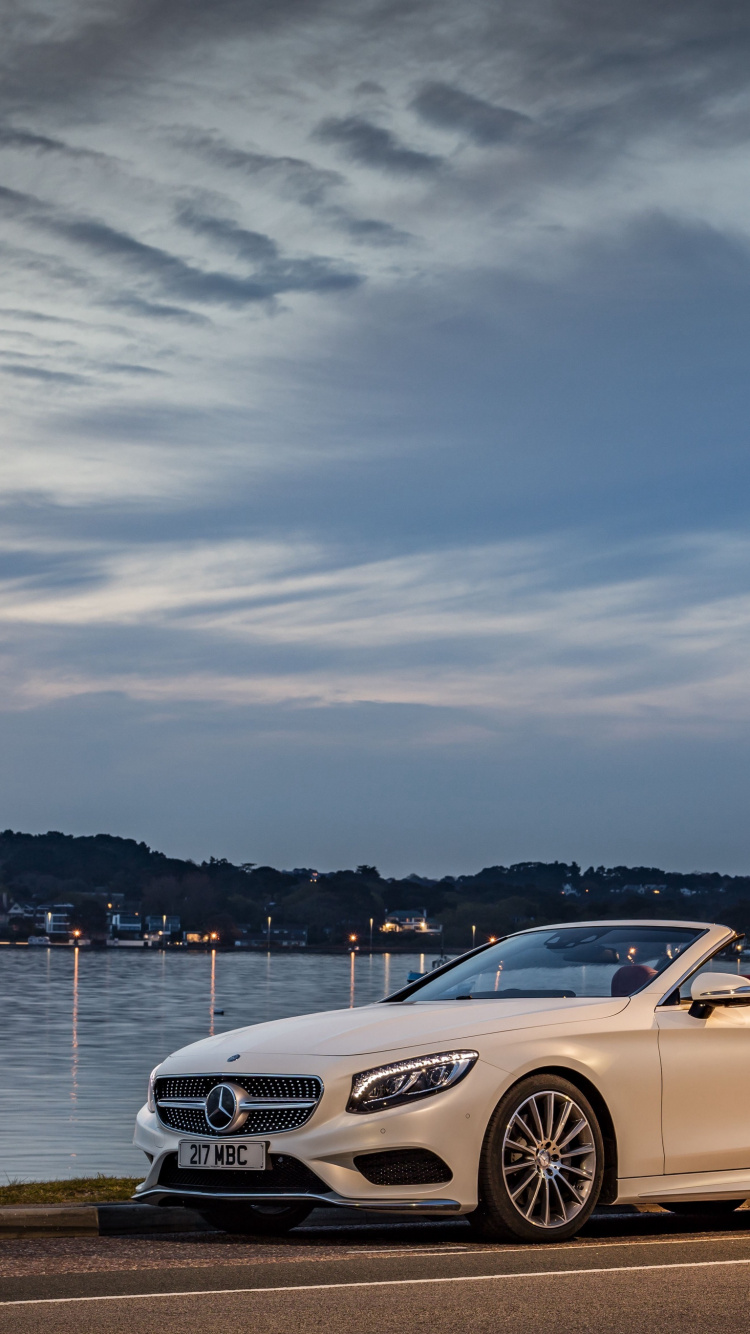 White Mercedes Benz Coupe Parked Near Body of Water During Daytime. Wallpaper in 750x1334 Resolution