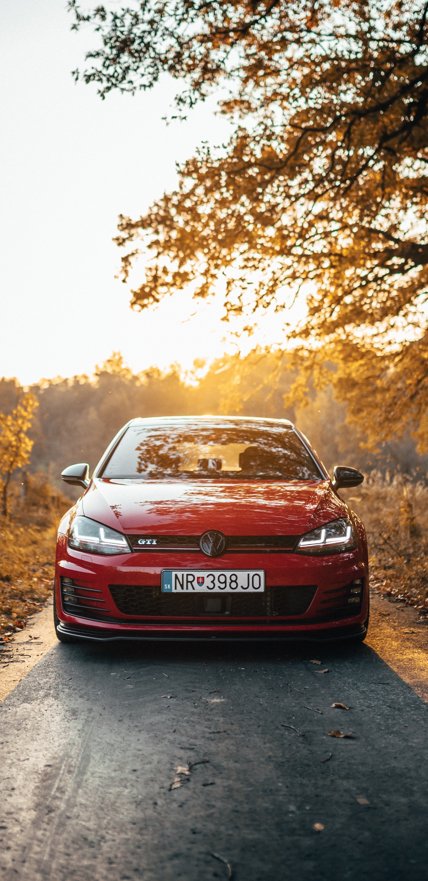 Red Car on Dirt Road During Daytime. Wallpaper in 1440x2960 Resolution