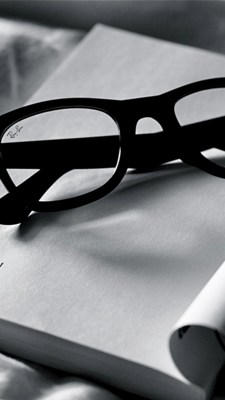 Black Framed Eyeglasses on White Paper. Wallpaper in 720x1280 Resolution