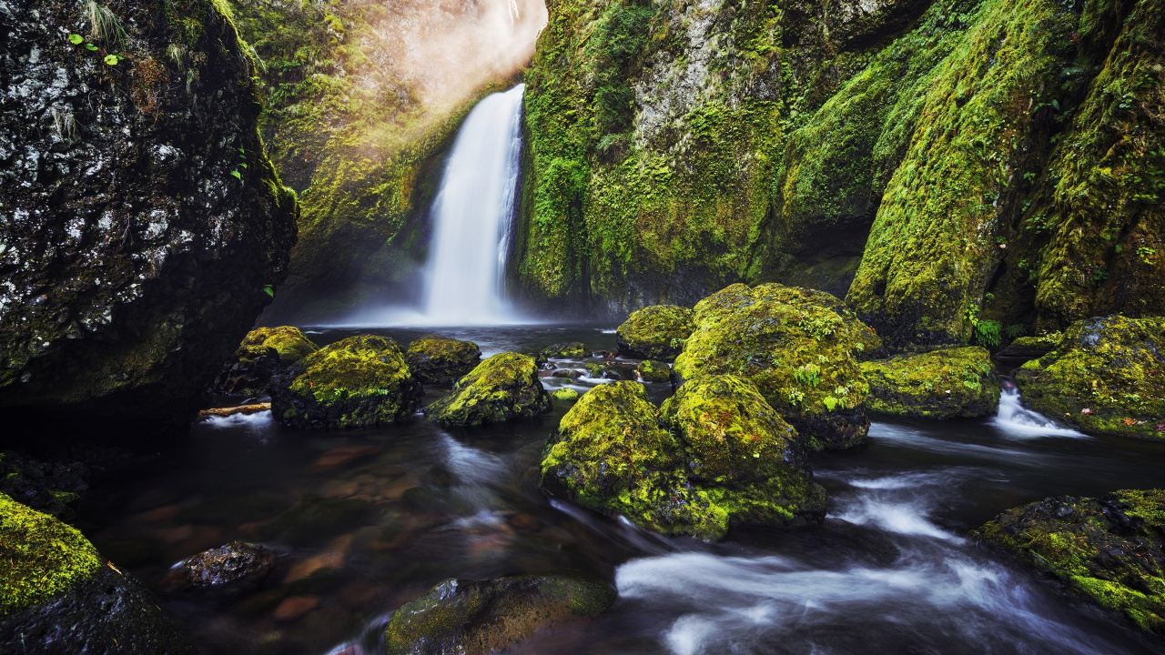Water Falls in The Middle of Green Moss Covered Rocks. Wallpaper in 1280x720 Resolution