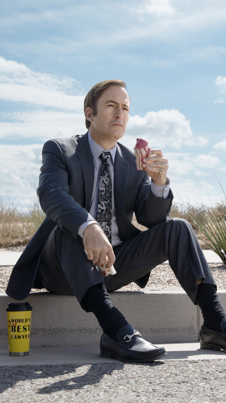 Man in Black Leather Jacket Sitting on Yellow Plastic Trash Bin. Wallpaper in 750x1334 Resolution