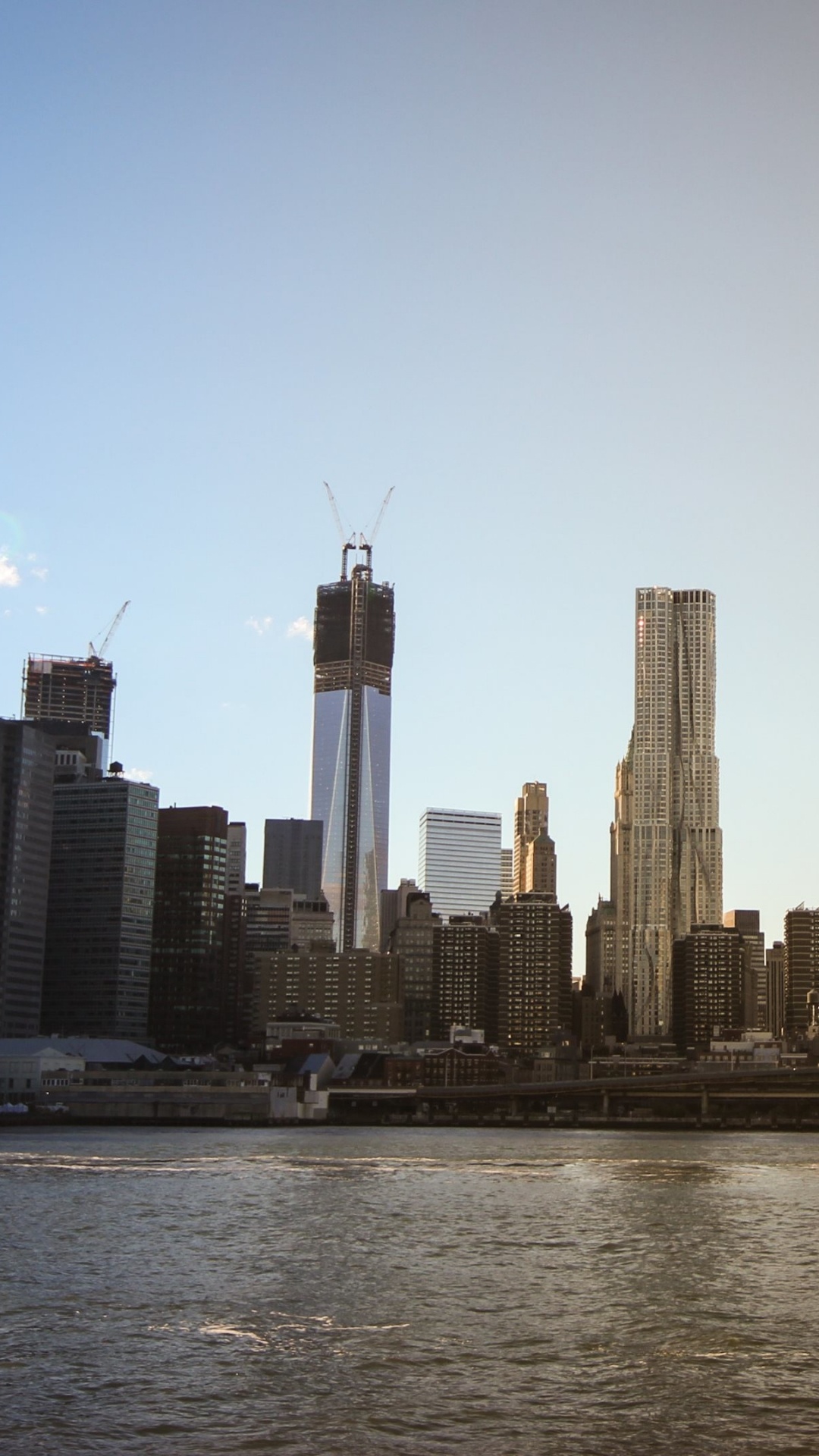 City Skyline Across Body of Water During Daytime. Wallpaper in 1080x1920 Resolution