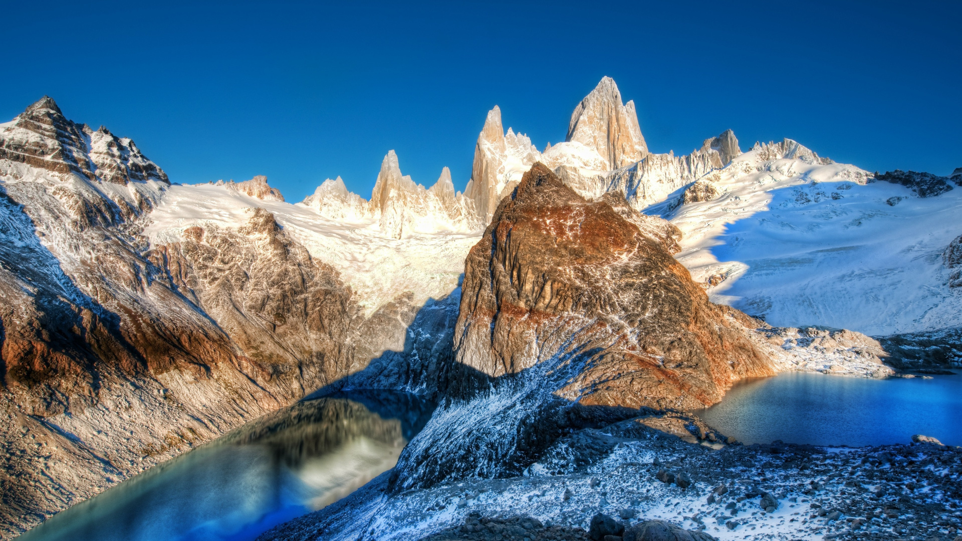 Brown and White Mountain Range Under Blue Sky During Daytime. Wallpaper in 1920x1080 Resolution