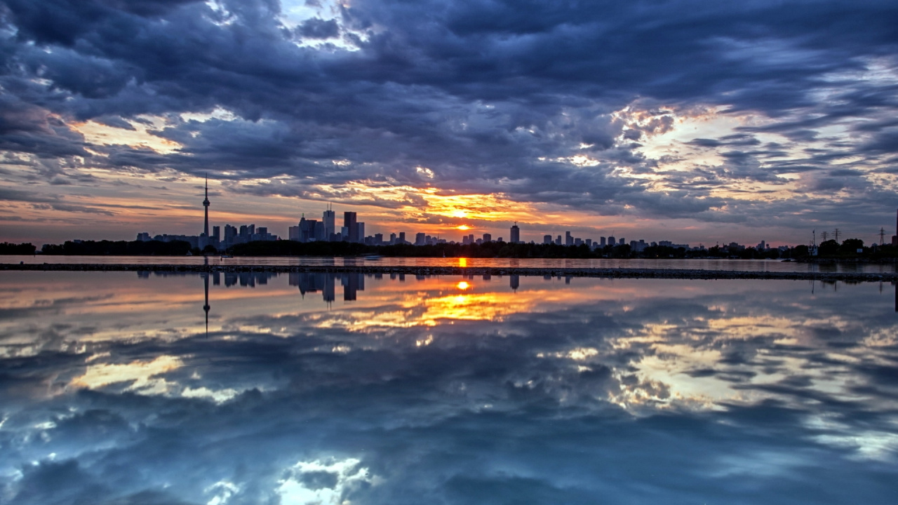 Body of Water Under Cloudy Sky During Sunset. Wallpaper in 1280x720 Resolution