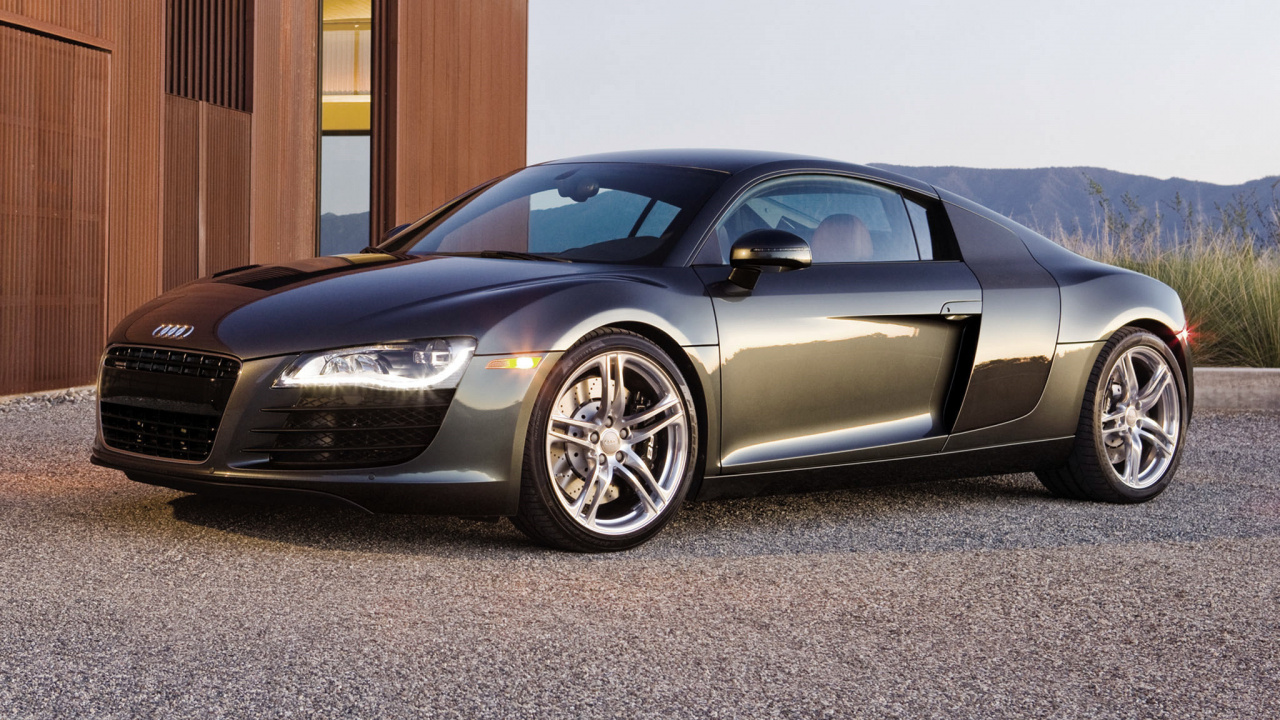 Black Porsche 911 Parked on Gray Pavement. Wallpaper in 1280x720 Resolution