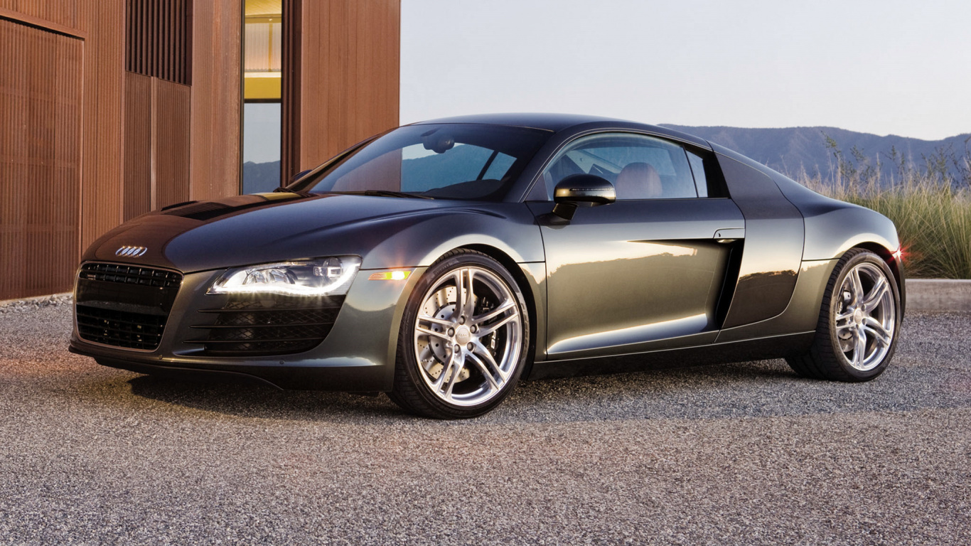 Black Porsche 911 Parked on Gray Pavement. Wallpaper in 1366x768 Resolution