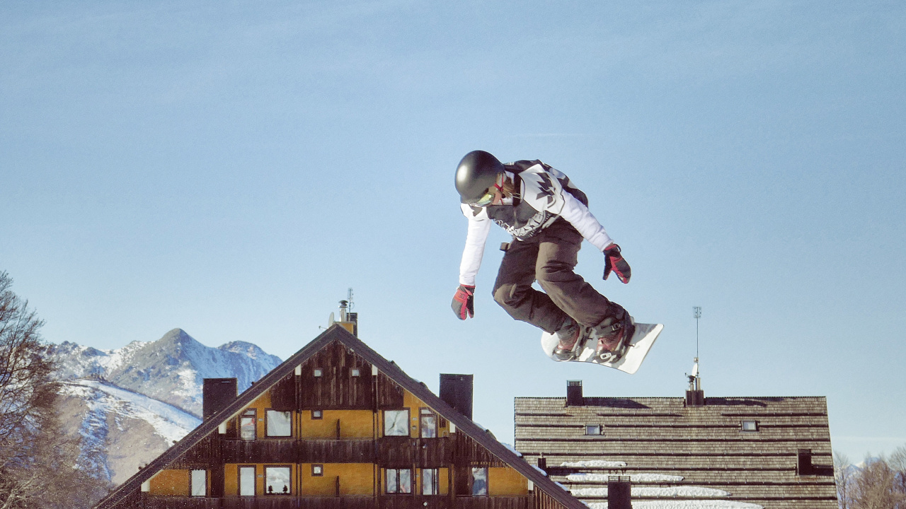 Man in White Jacket and Black Pants Jumping on Mid Air During Daytime. Wallpaper in 1280x720 Resolution