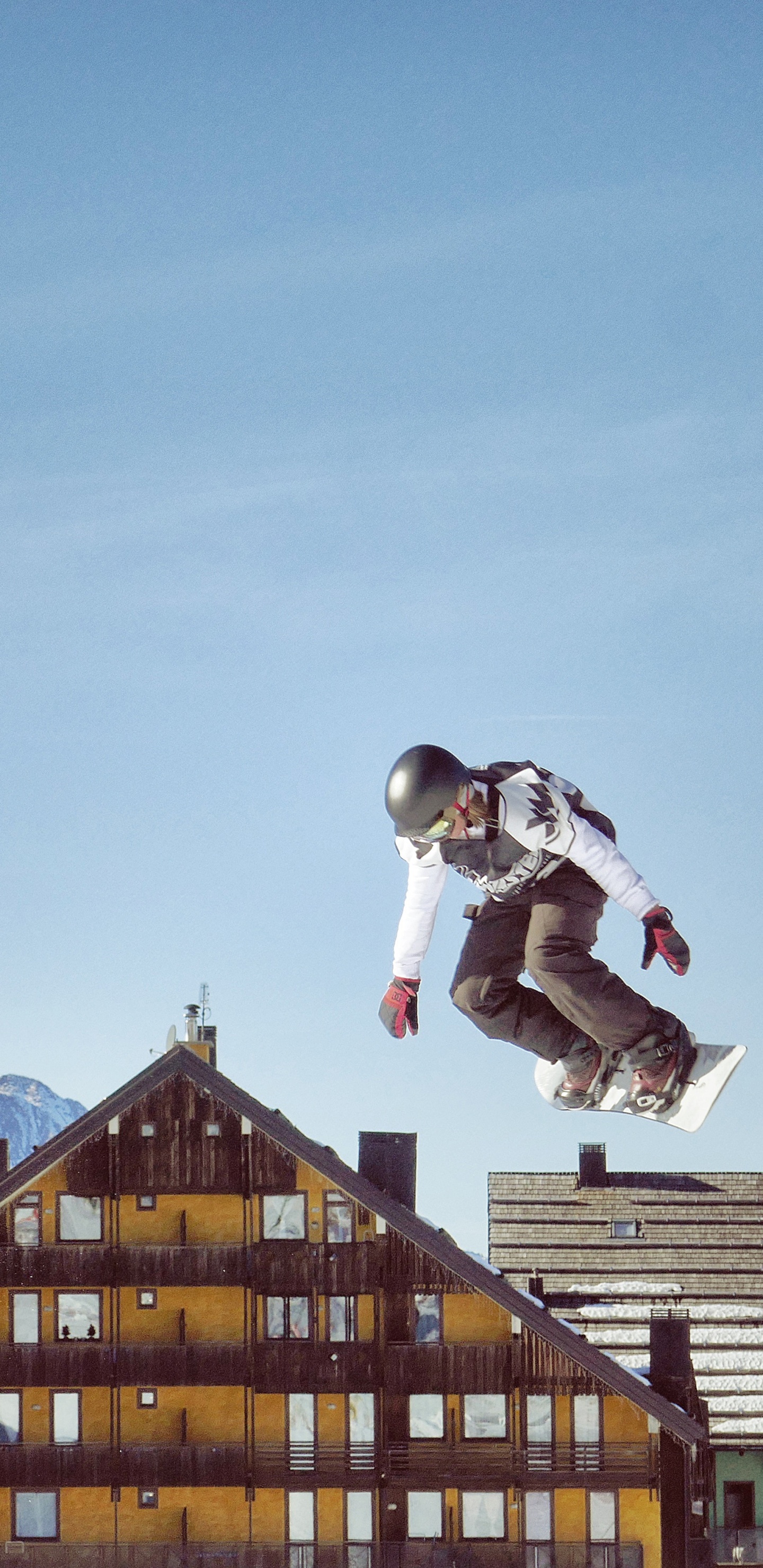 Man in White Jacket and Black Pants Jumping on Mid Air During Daytime. Wallpaper in 1440x2960 Resolution