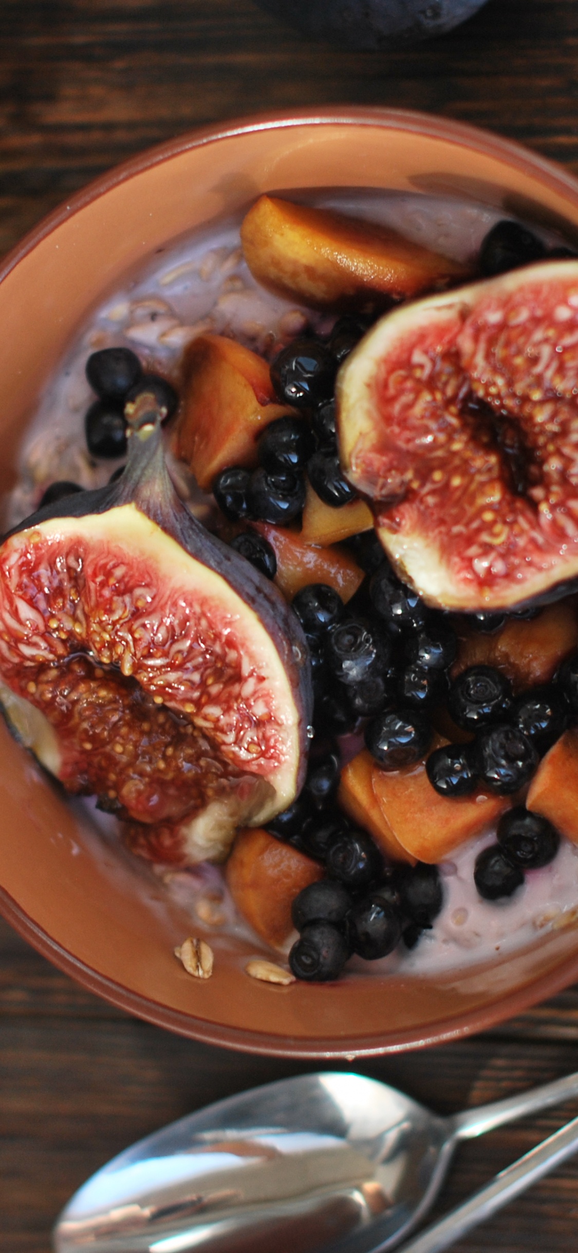 Sliced Fruit on Brown Ceramic Bowl. Wallpaper in 1125x2436 Resolution