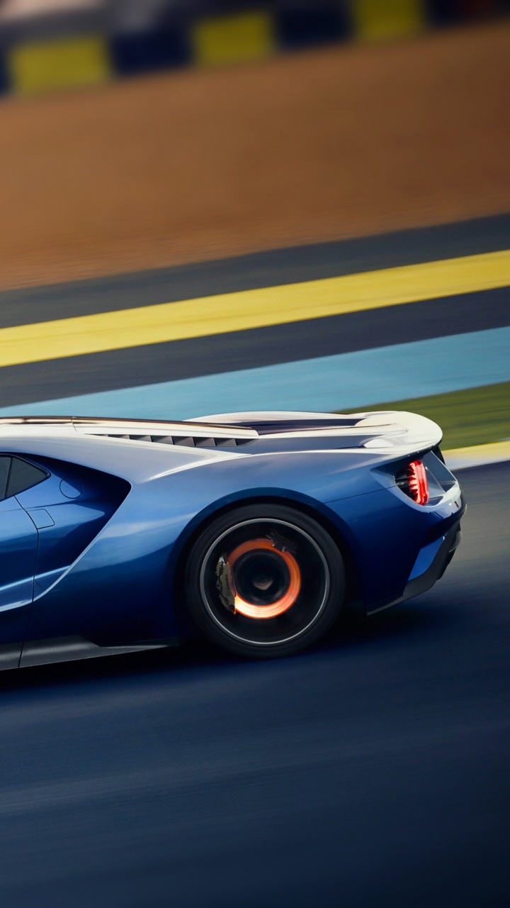 Blauer Porsche 911 Tagsüber Unterwegs. Wallpaper in 720x1280 Resolution