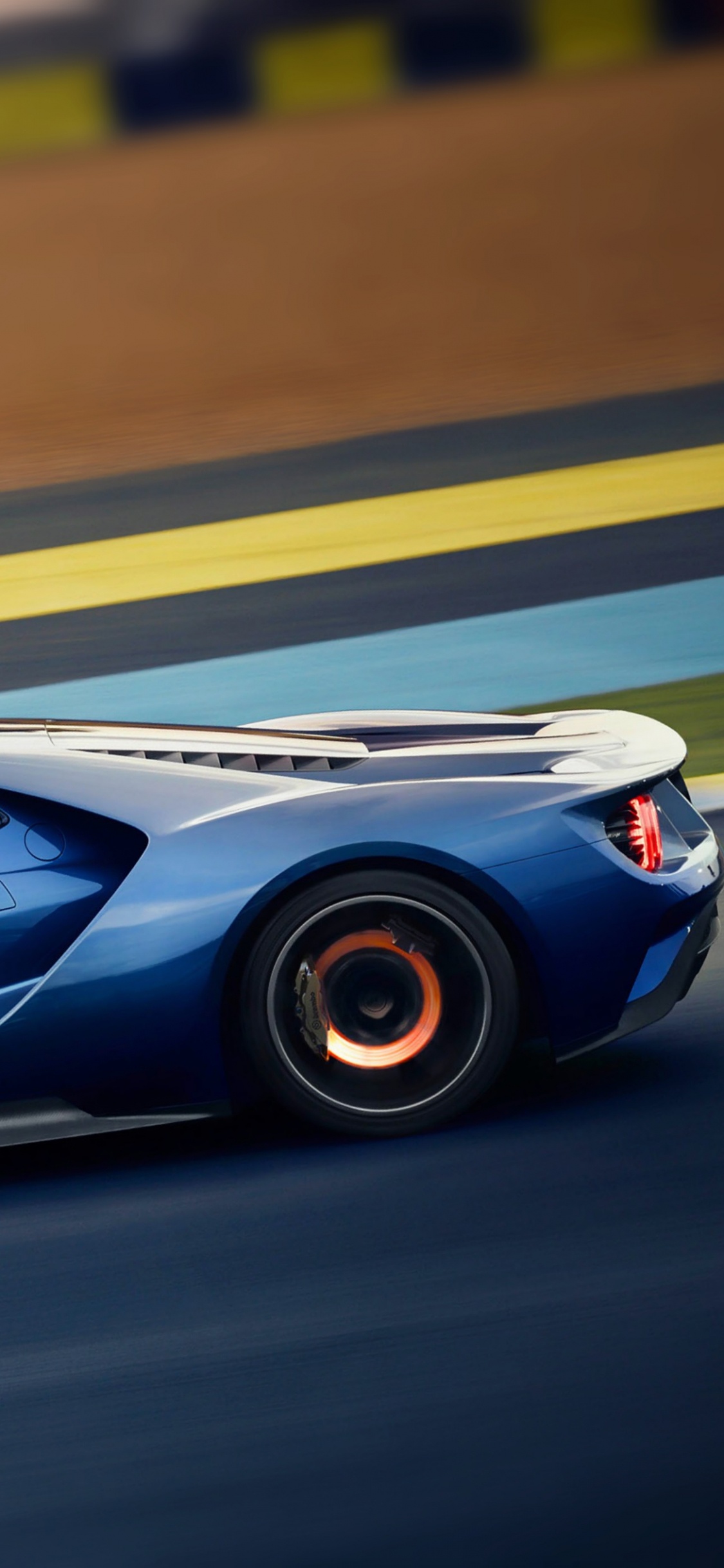 Porsche 911 Bleue Sur Route Pendant la Journée. Wallpaper in 1125x2436 Resolution