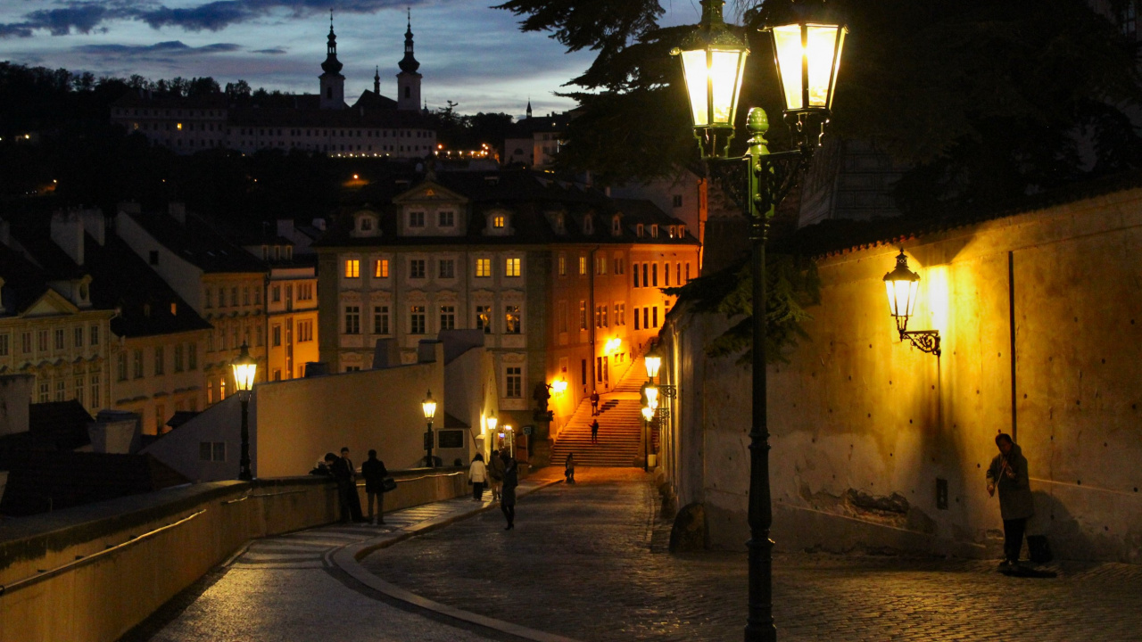 People Walking on Sidewalk Near Building During Night Time. Wallpaper in 1280x720 Resolution